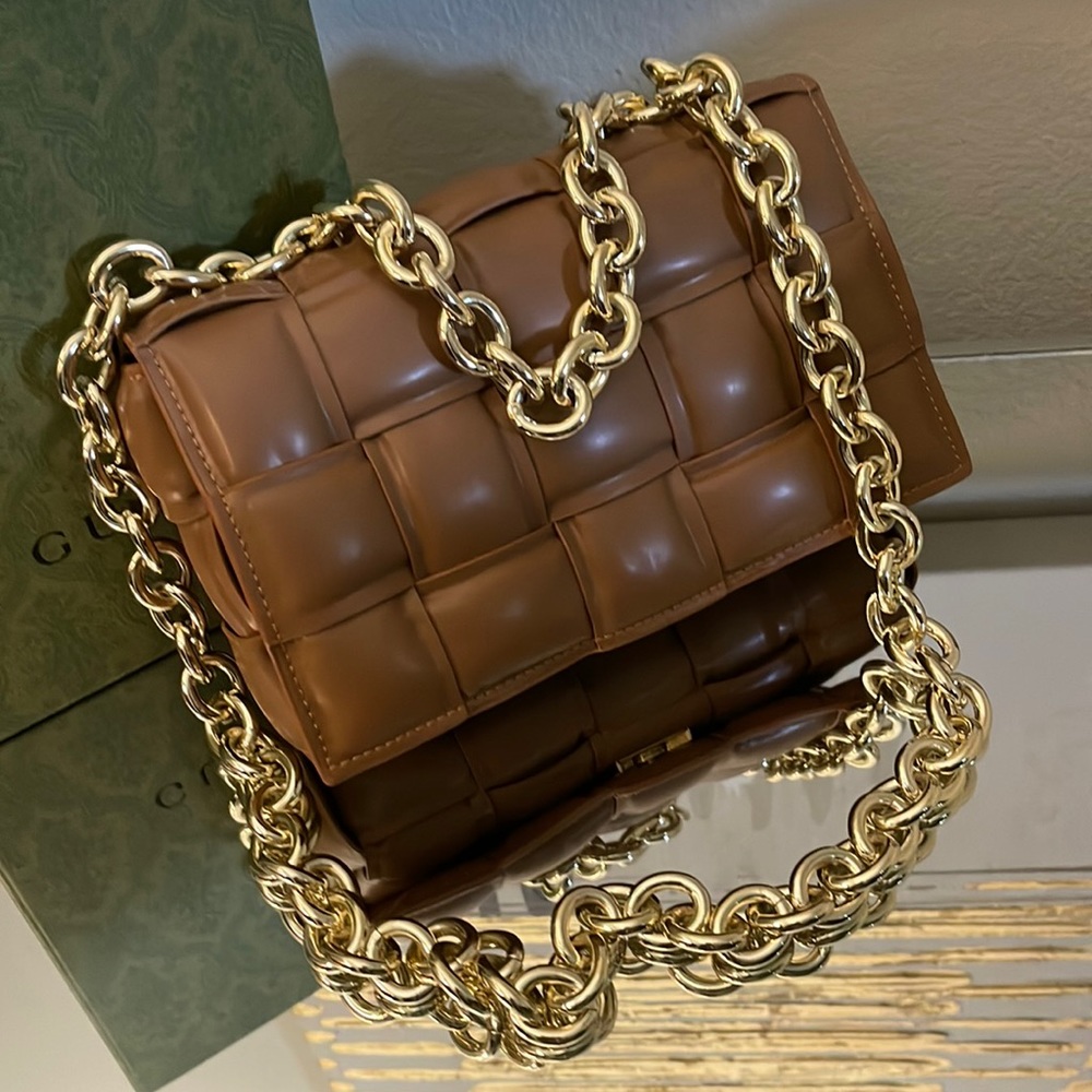 EvaLuLu bag with gold short and long chain straps.